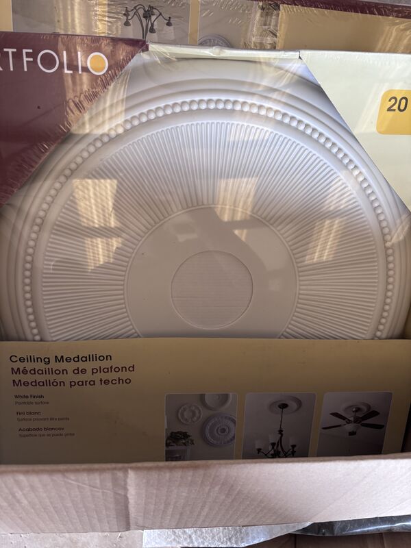 White ceiling medallion in packaging